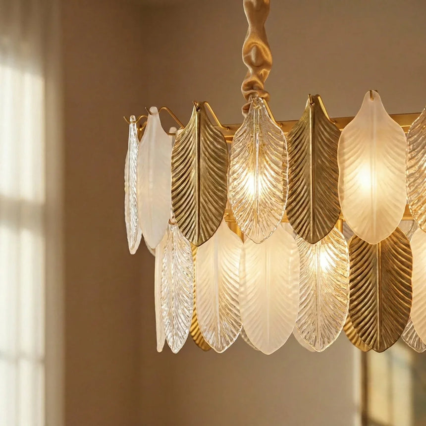 The feather shades lit close, gold and frosted pieces alternating in a tier