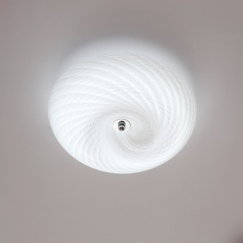 Swirled glass ceiling light seen straight from below showing the spiral pattern