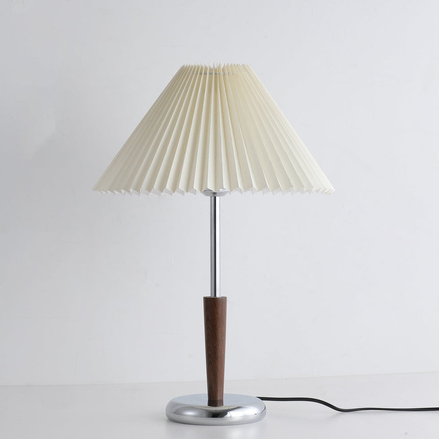 Chrome table lamp seen small against a plain pale background