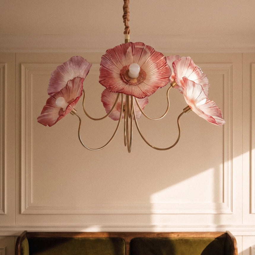 The red poppies lit in a paneled room above a green velvet sofa