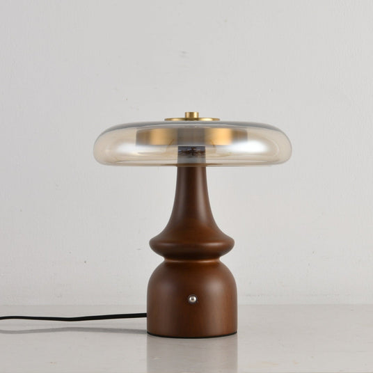 Close view of the stepped spindle turning on the walnut base
