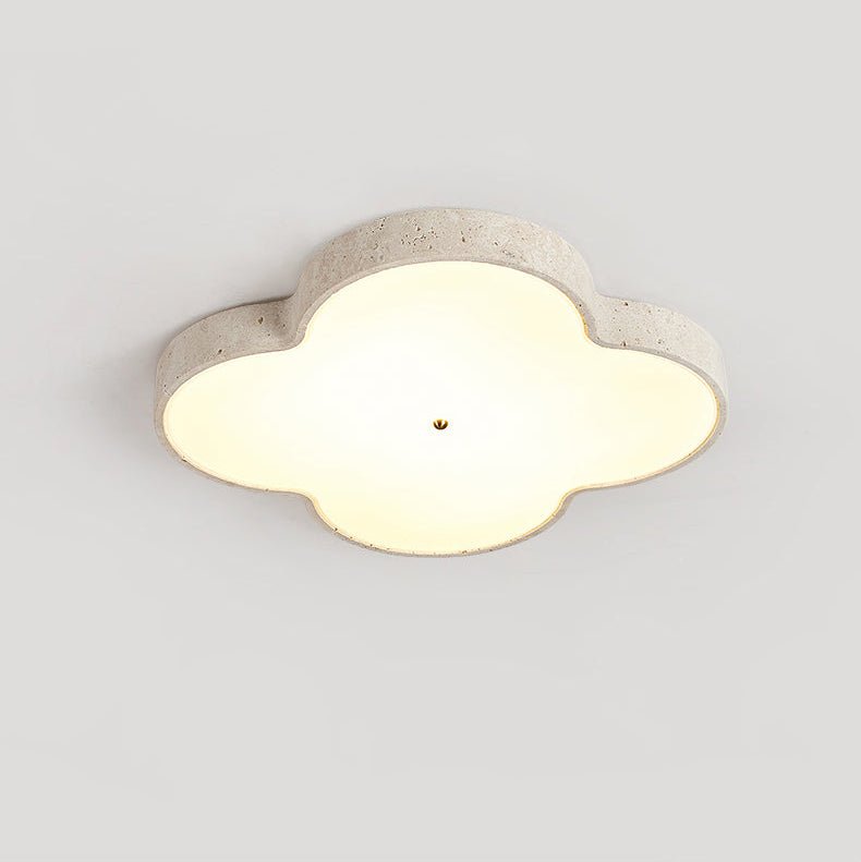 Cloud ceiling lamp lit straight on, the stone rim framing the white glass face