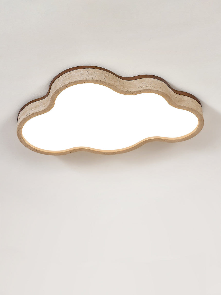 Lit cloud ceiling light showing the travertine band around the white acrylic face