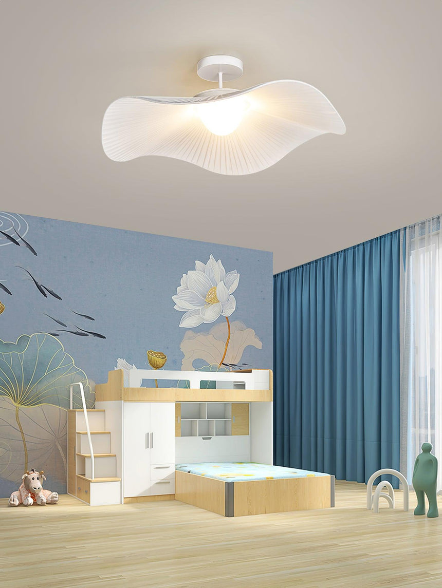 Fabric wing ceiling light in a playroom with a blue wall and a lotus mural