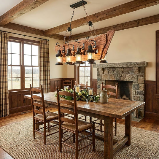 Chandelier lit above a wood dining table in a room with a fireplace
