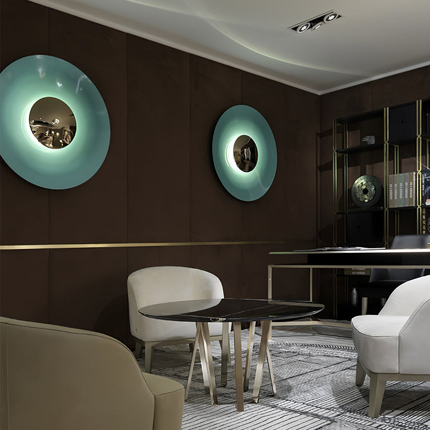 Blue disc lights glowing in a lounge with armchairs and a round table