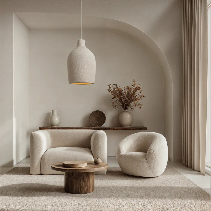 Tapered resin shade hung in a plaster alcove