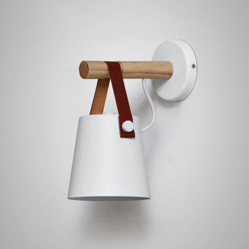 The white cone hanging from its wood bar on a white round backplate