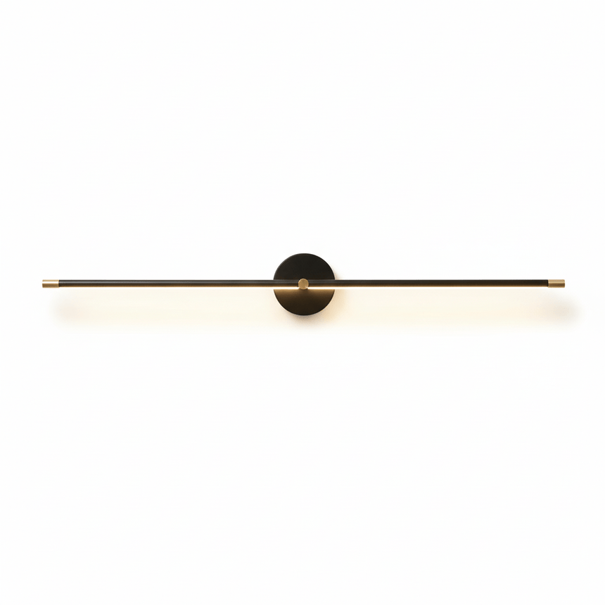 The black rod lit, the diffuser bright along its underside on a pale wall