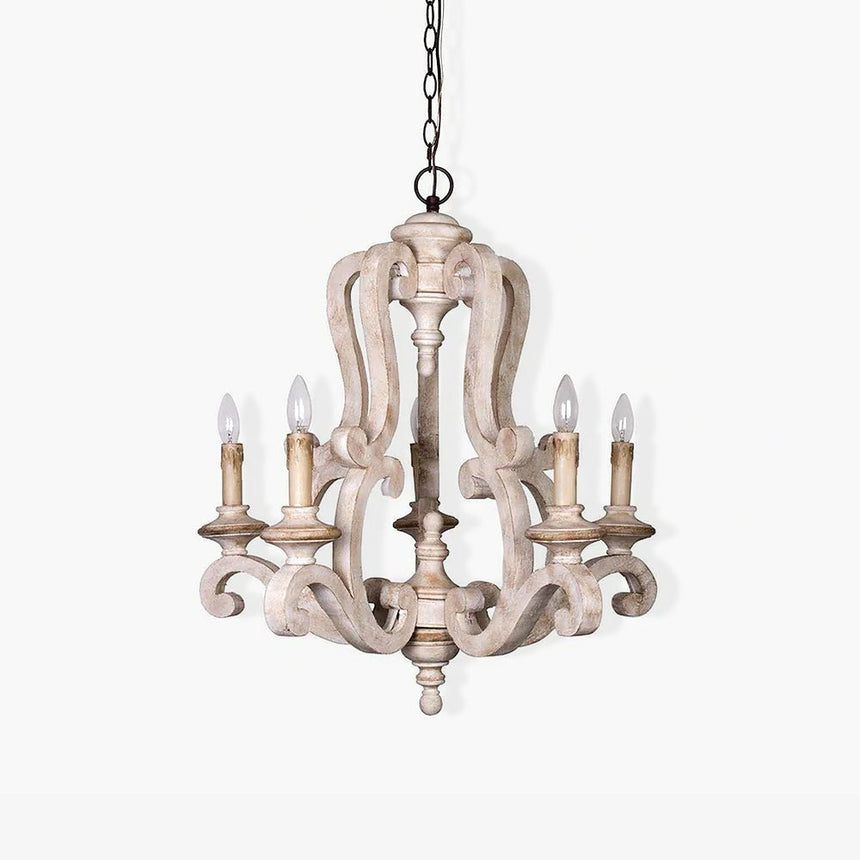 A carved wood frame of scrolls and spindles carrying five candle lamps on curved arms