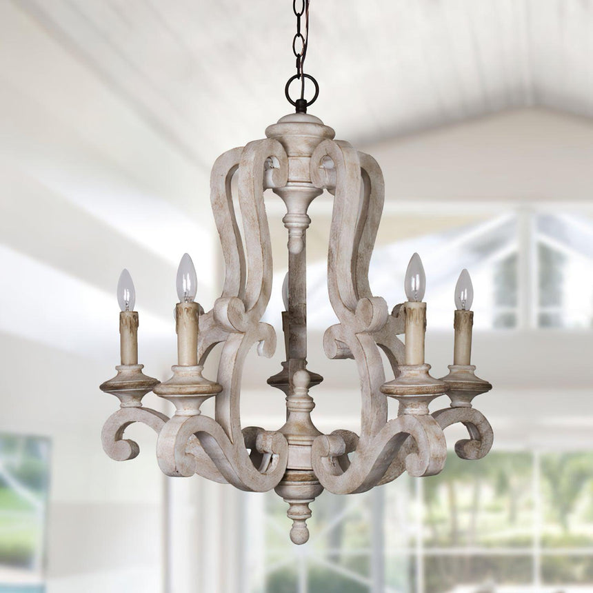 The frame lit under a white ceiling with windows and greenery behind