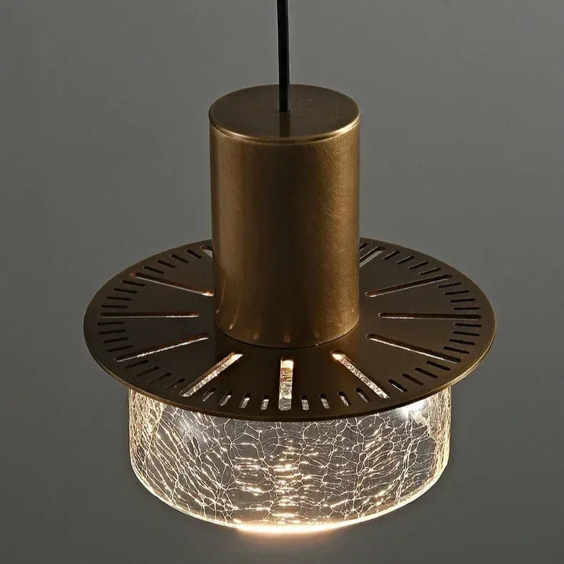 The fluted underside of the brass cap seen against a dark background