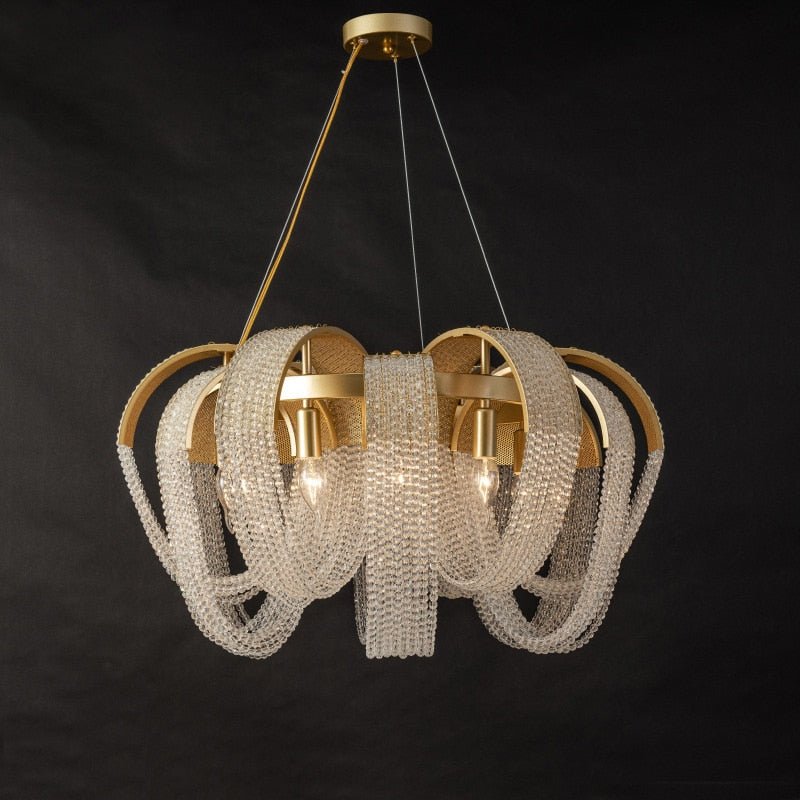 The round multi head version, gold arcs opening around curtains of beads