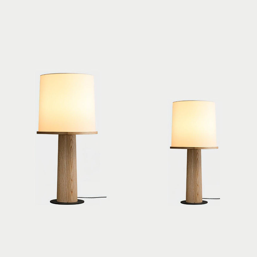 Two cylinder table lamps of different heights side by side