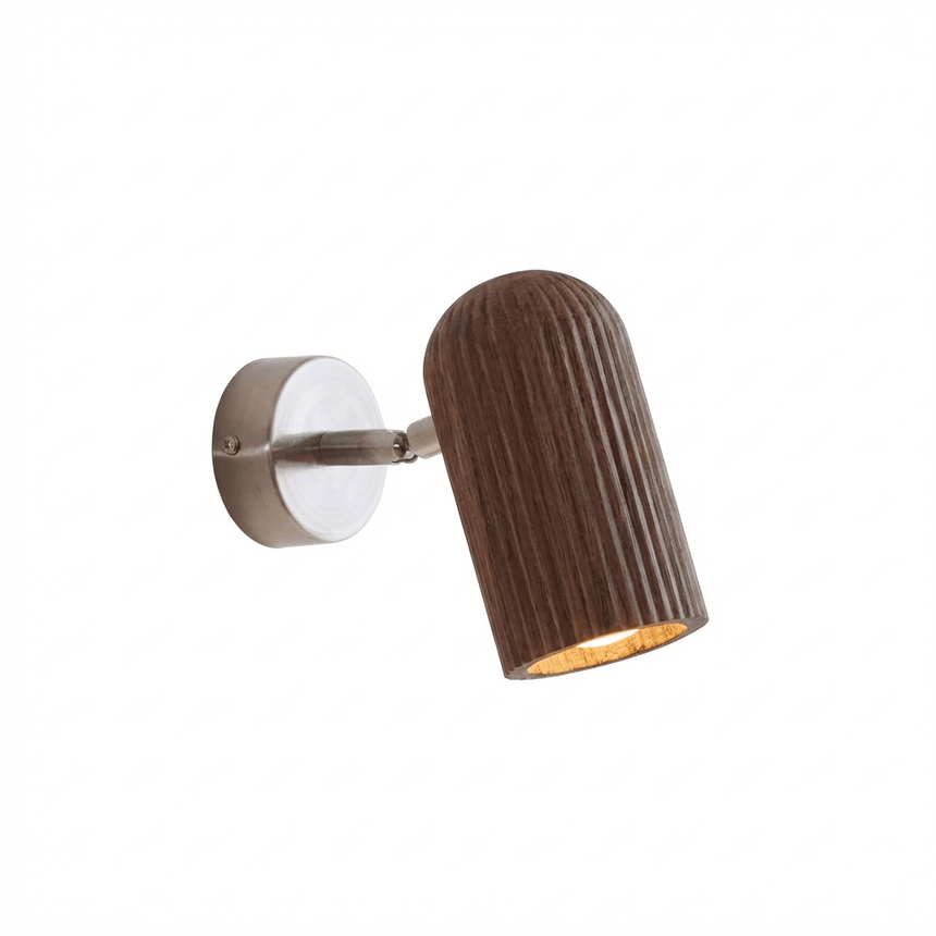 Fluted walnut cylinder angled down from a brushed nickel wall plate