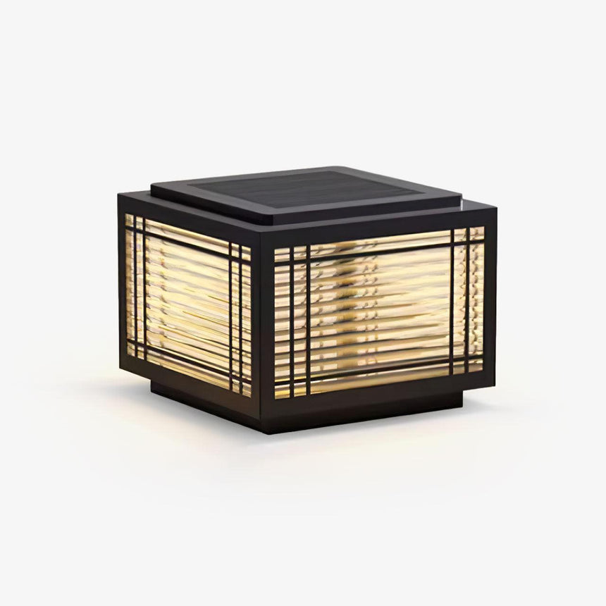Square post cap with a ribbed glass lantern behind a slim black grid