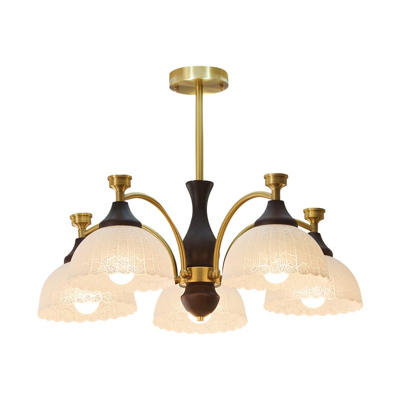 Ribbed opal domes and the brass collars they sit in, seen close