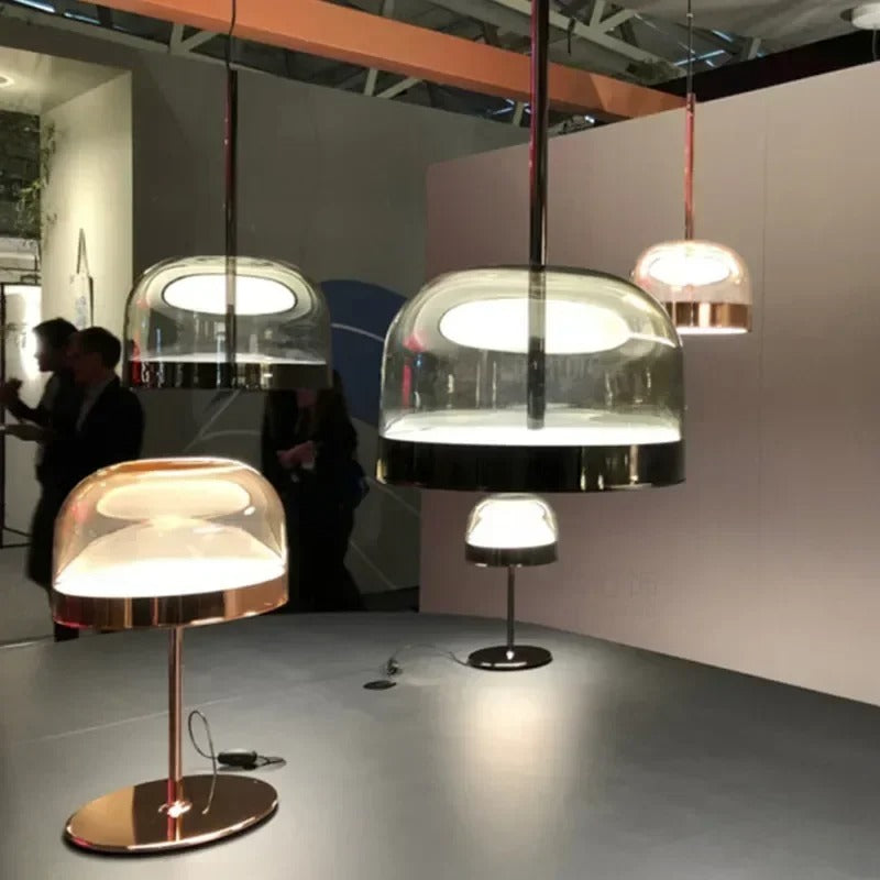 Tinted glass domes lit above a dining table