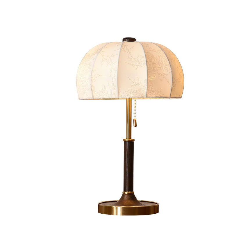 Segmented dome lamp with a dark stem and a brass foot, plain ground