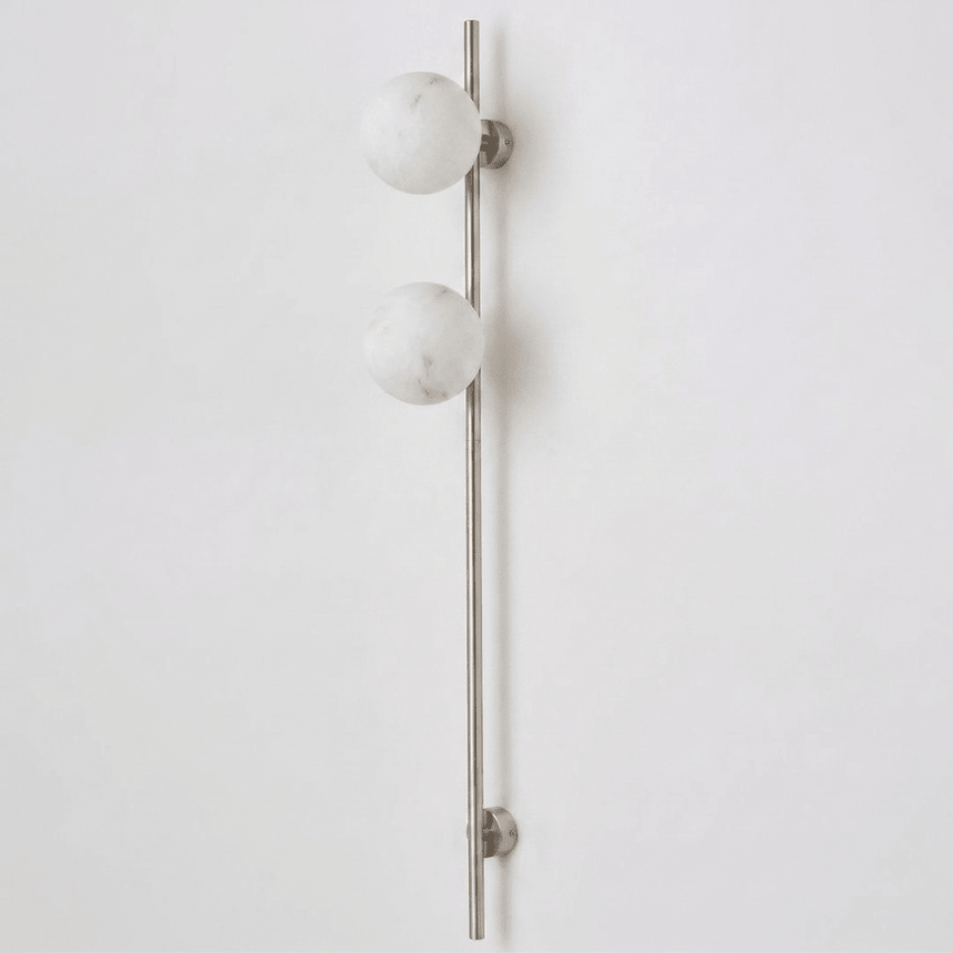 The nickel version with two stone globes on a white background