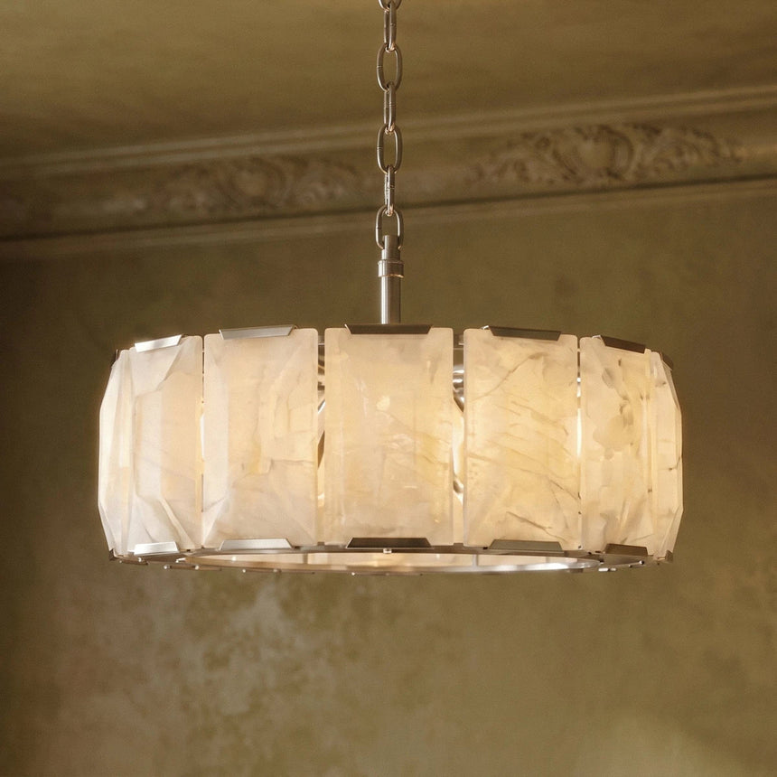 The lit drum seen against a molded cornice on a green wall