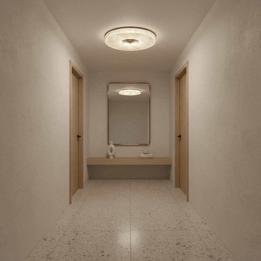 Ribbed drum ceiling light in a corridor leading to a washbasin