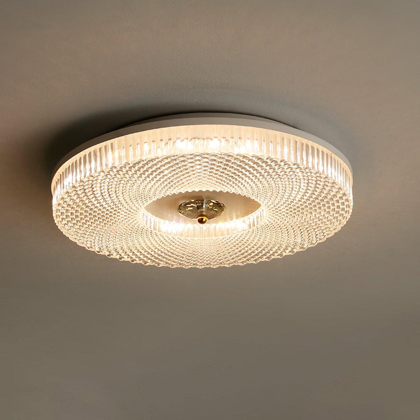 Ribbed drum ceiling light with a dark rim seen at an angle
