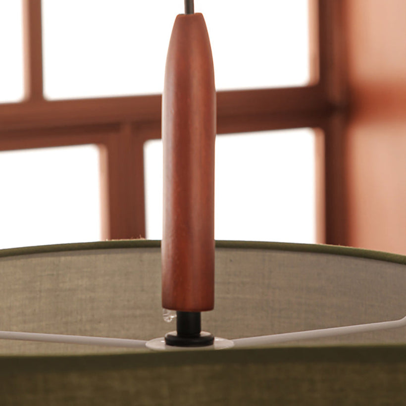 Detail of the turned wood finial under the lowest drum