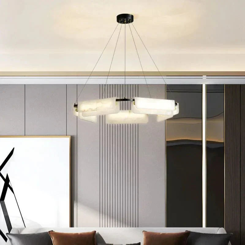 Chandelier casting warm glow through alabaster stones