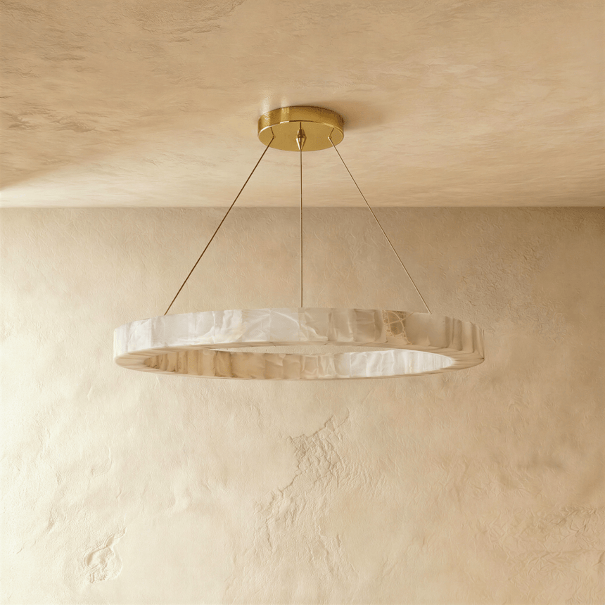 One stone ring seen edge on against a pale plaster wall