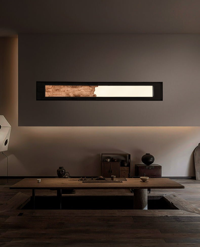 Bar mounted flat above a long low table in a dim living room