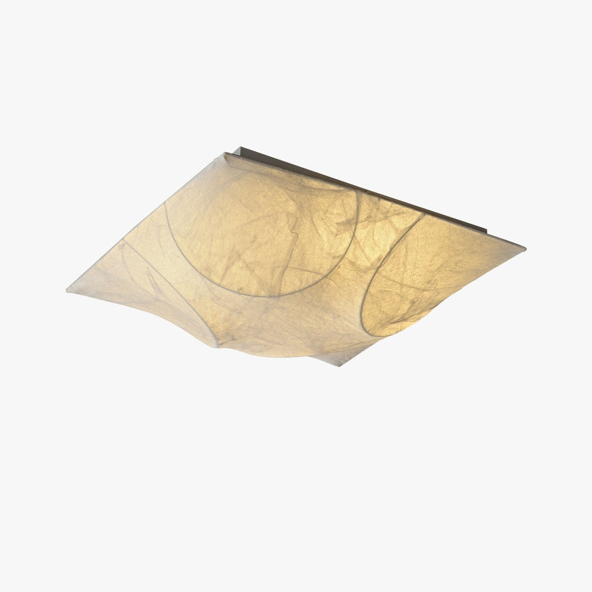 Square silk ceiling light seen at an angle against a plain backdrop