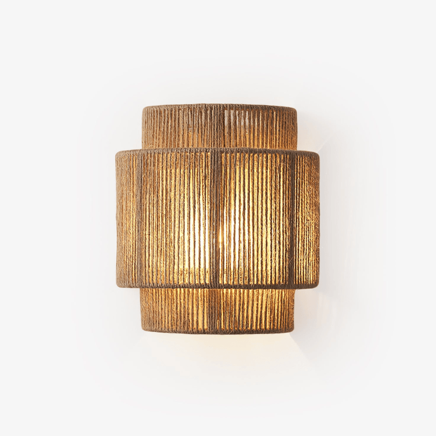 Wall lamp with a two tier shade of handwoven hemp rope, lit warm from inside