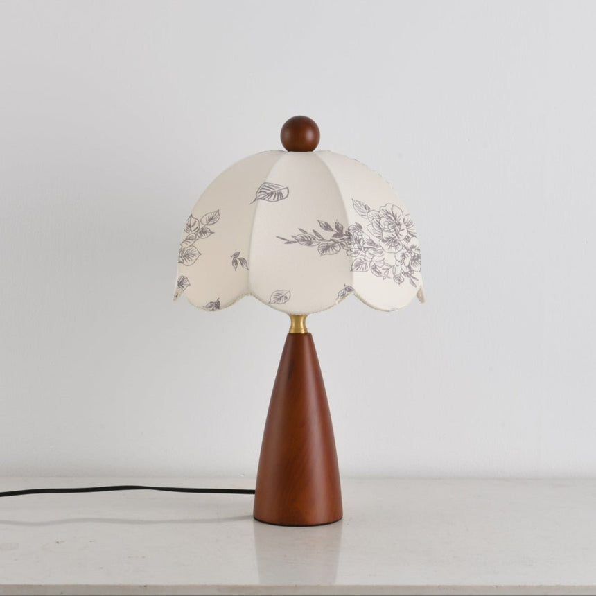 Floral table lamp unlit from the front, the printed motifs in view
