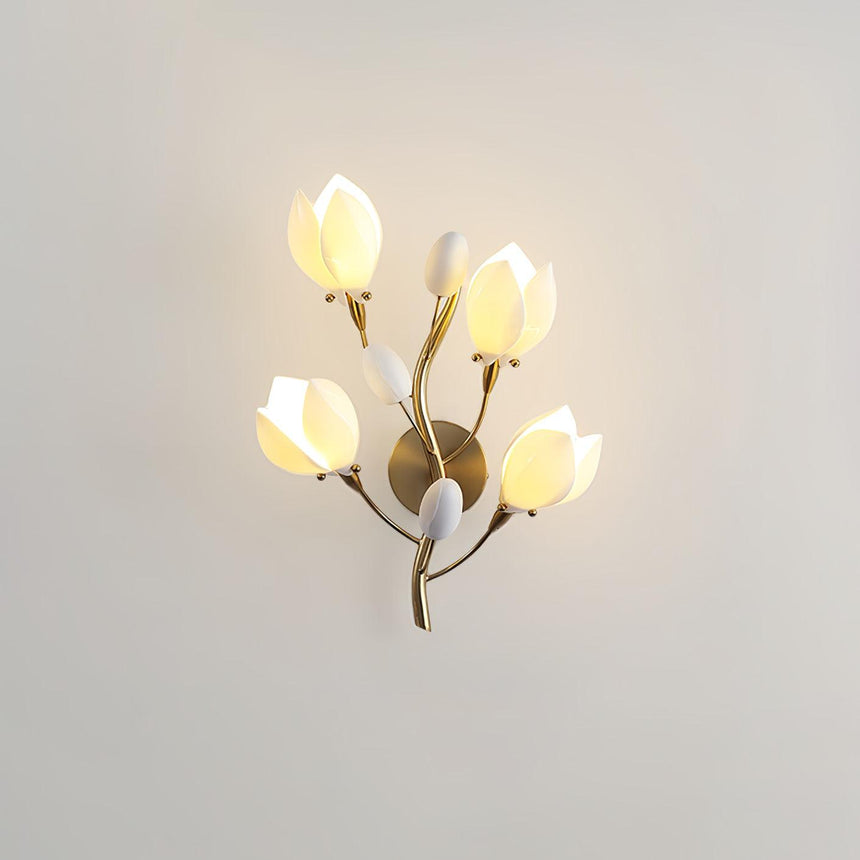 The magnolia light glowing on a pale wall, each bloom lit from inside