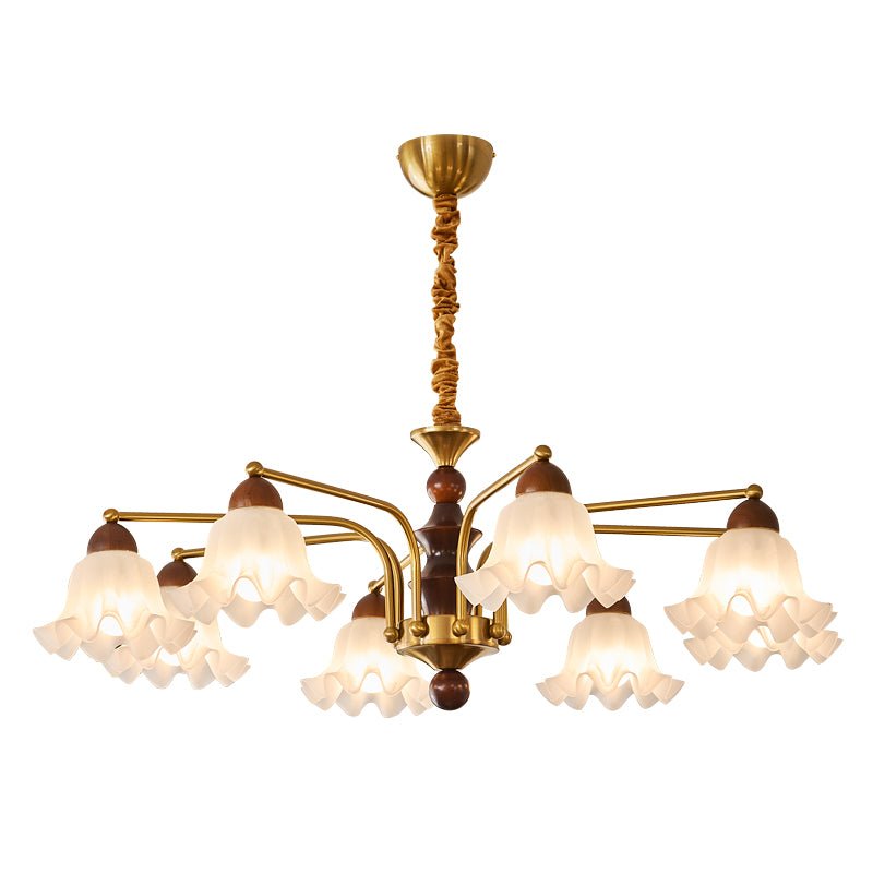 Fluted glass bells and the gold collars holding them to the arms