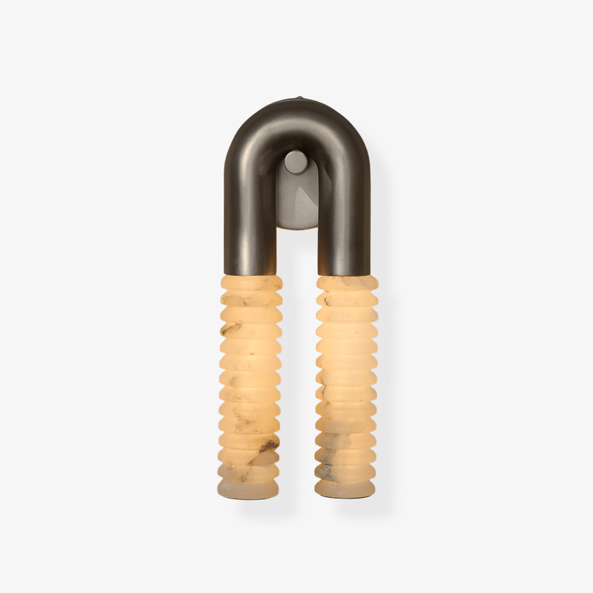 The sconce on a plain background, two ribbed columns under a metal arch