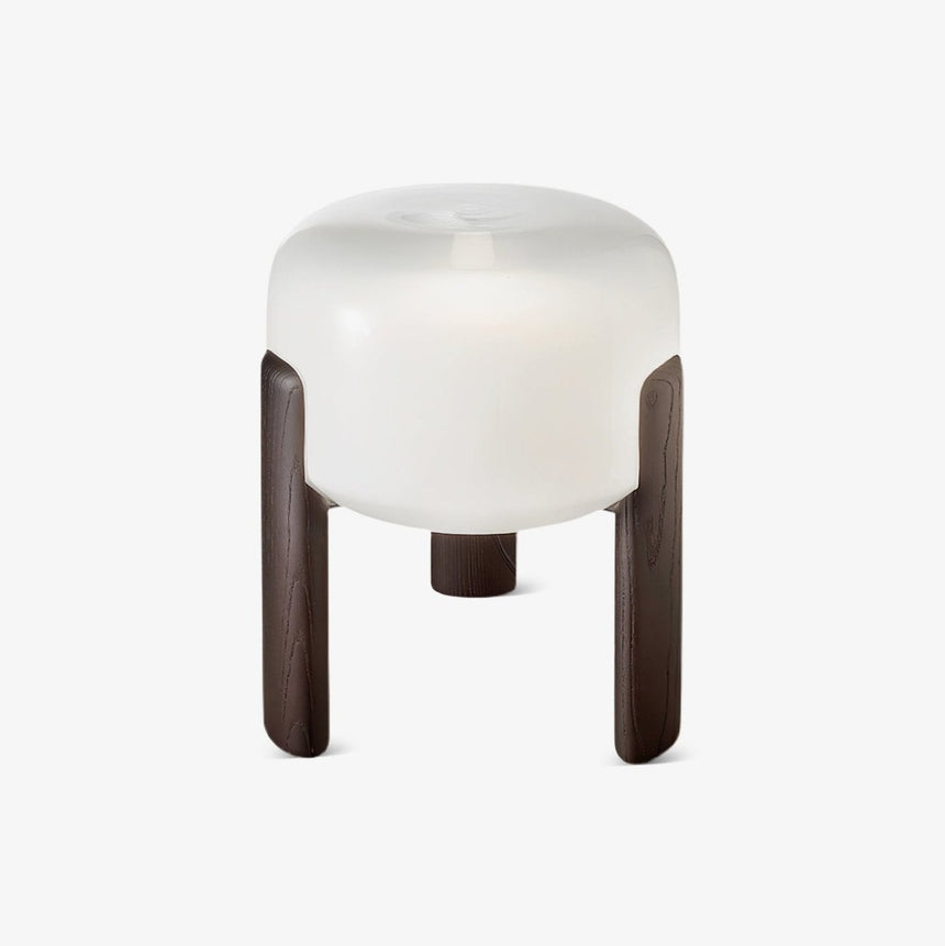Frosted glass table lamp held between three dark walnut legs, plain ground