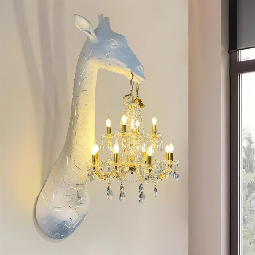 The giraffe lamp lit on a pale wall beside a tall window