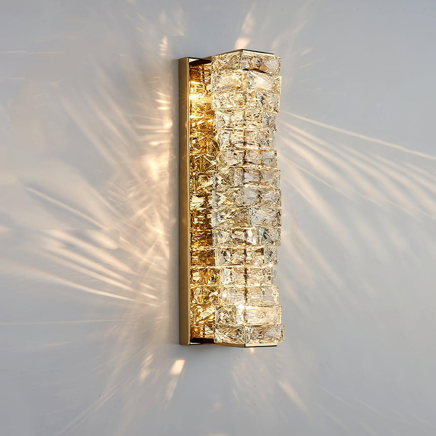 The gold version lit, the crystal blocks throwing rays across the wall