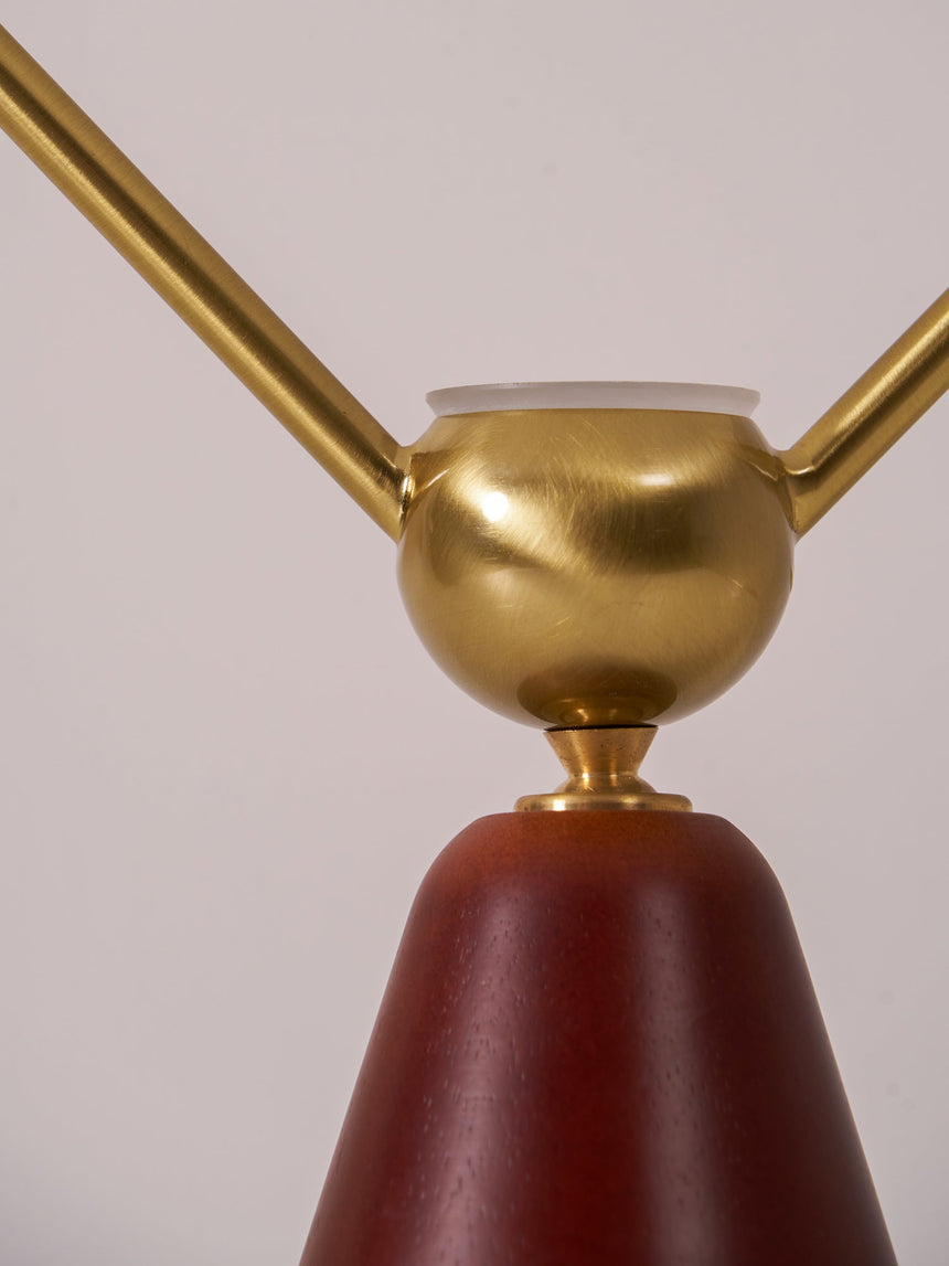 Close view of the brass sphere where the two arms meet the cone