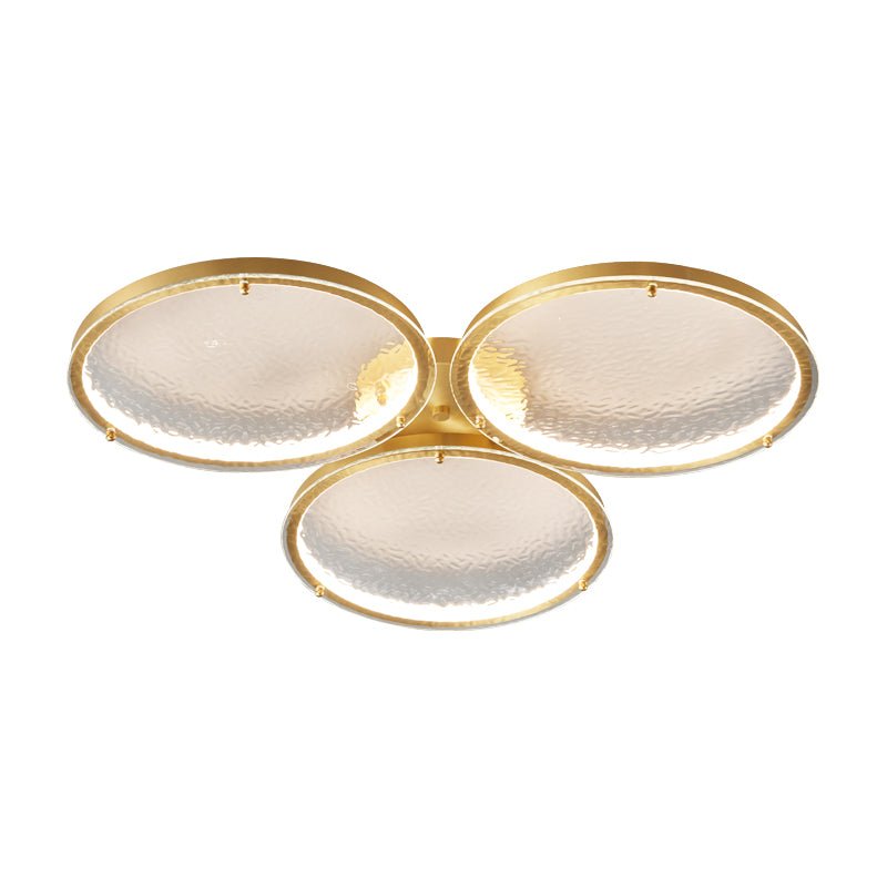 Larger three ring gold ceiling light on a white backdrop