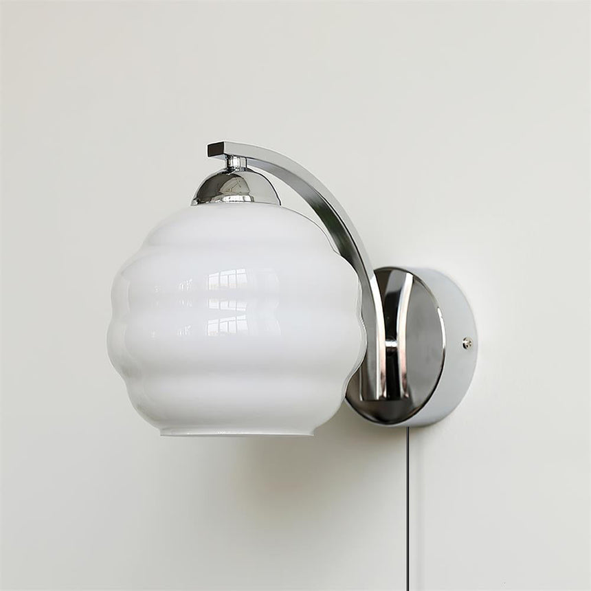 The chrome version with a white ribbed glass globe and its cord
