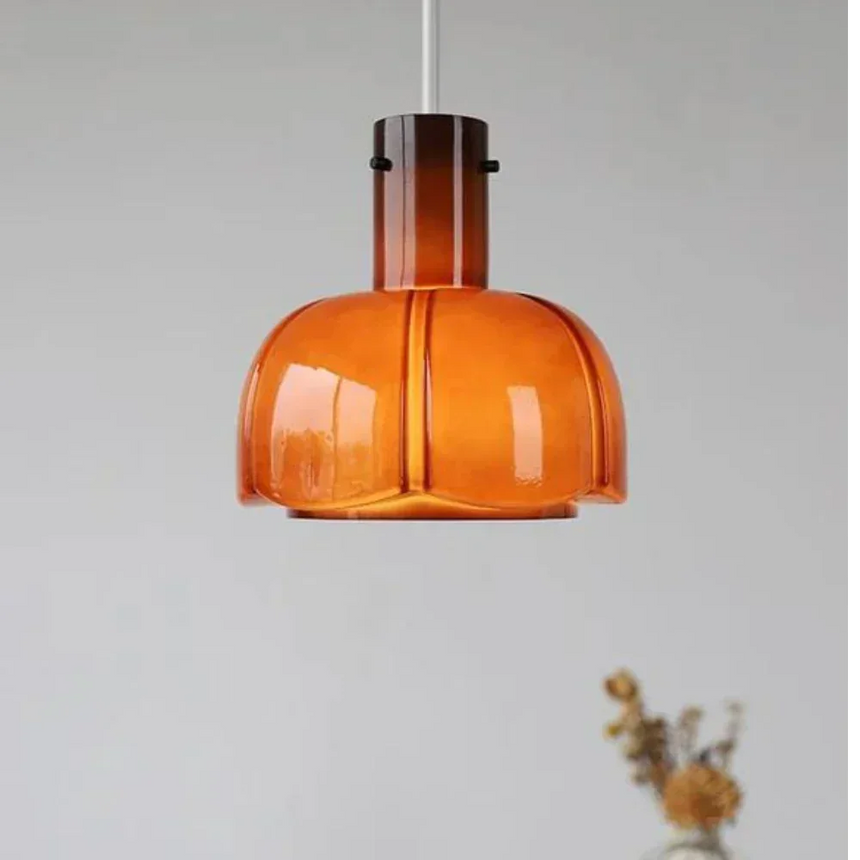 The orange shade shown on its own against a pale wall