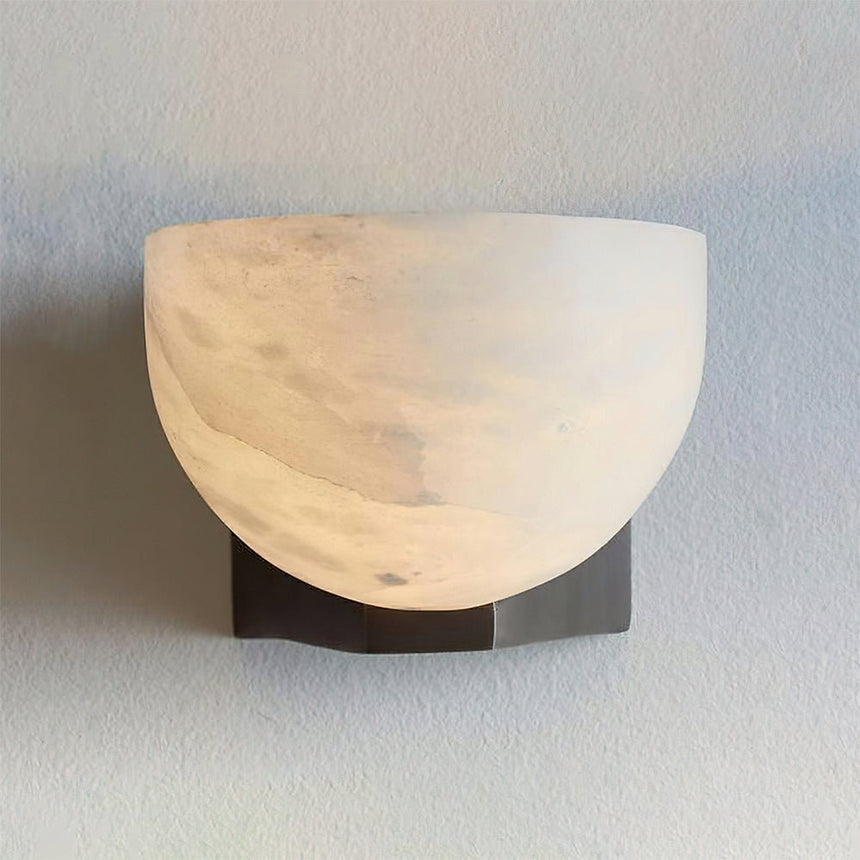 The stone bowl lit from inside, the veining showing through