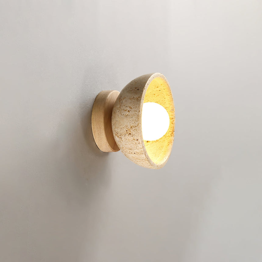The pale wood version seen from the front, the bowl glowing at its center