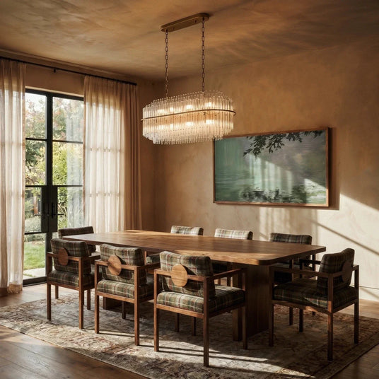 The linear version lit above a long dining table with chairs, artwork and a rug