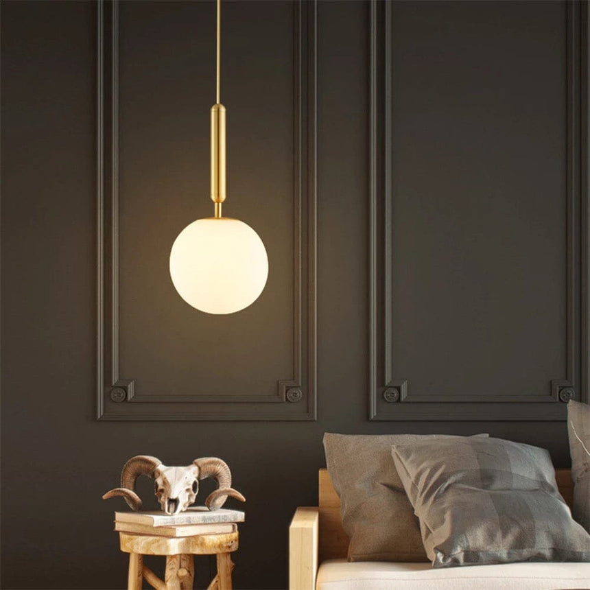 Aluminum pendant light installed above dining table