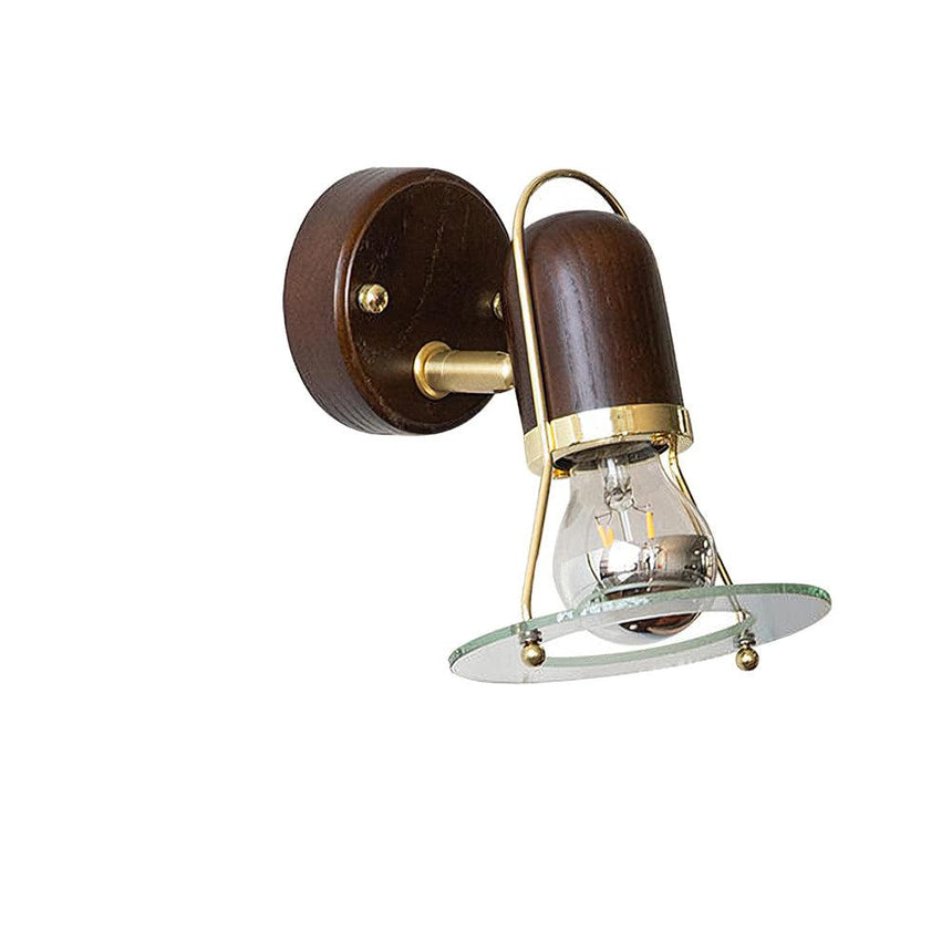 The fitting in profile, the barrel tipped down off its short brass arm