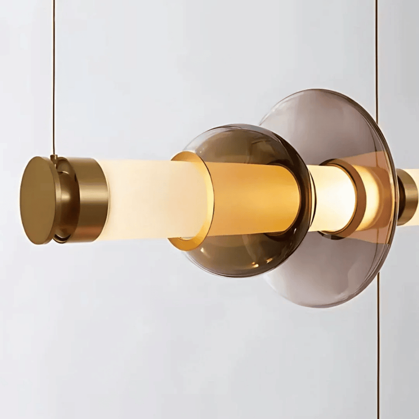 Close view of the brass collar joining two sections of the lit tube